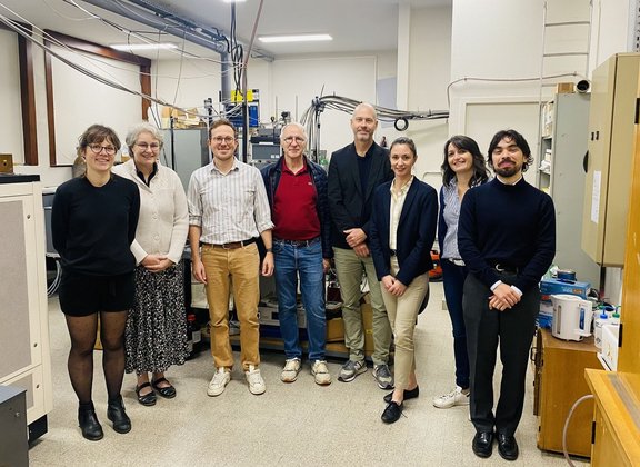 Group of people standing in a laboratory setting