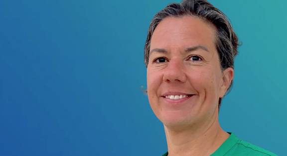 Alessa Hool in green clothing against a blue background