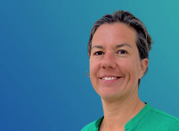 Alessa Hool in green clothing against a blue background