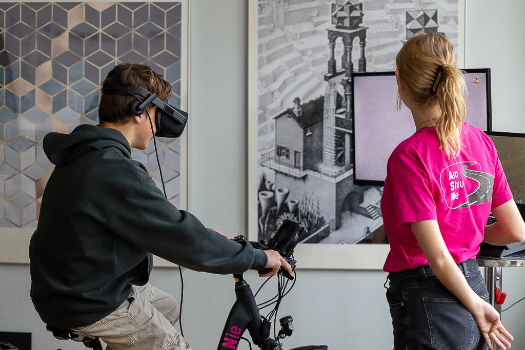Person on exercise bike with VR glasses in modern room