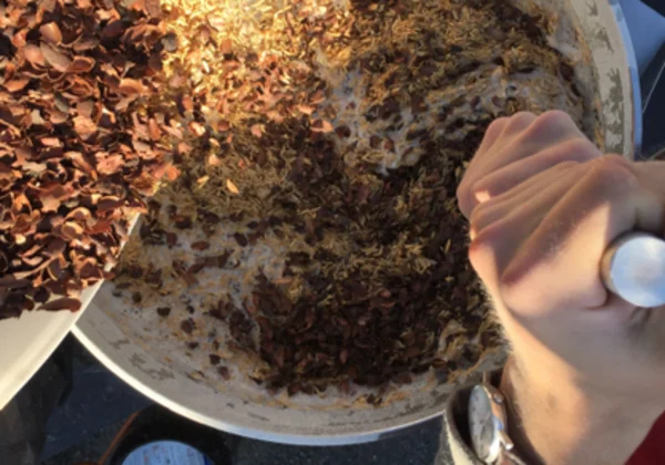 Brewing ingredients being mixed in a large pot