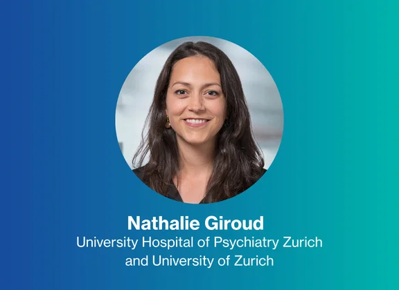 Portrait of Nathalie Giroud against a blue background