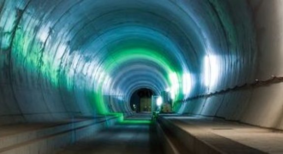 Illuminated tunnel with green and blue lights