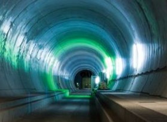 Illuminated tunnel with green and blue lights